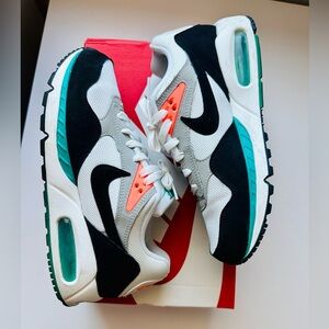 Nike Air Max Sneakers with Black, White, and Teal Accents